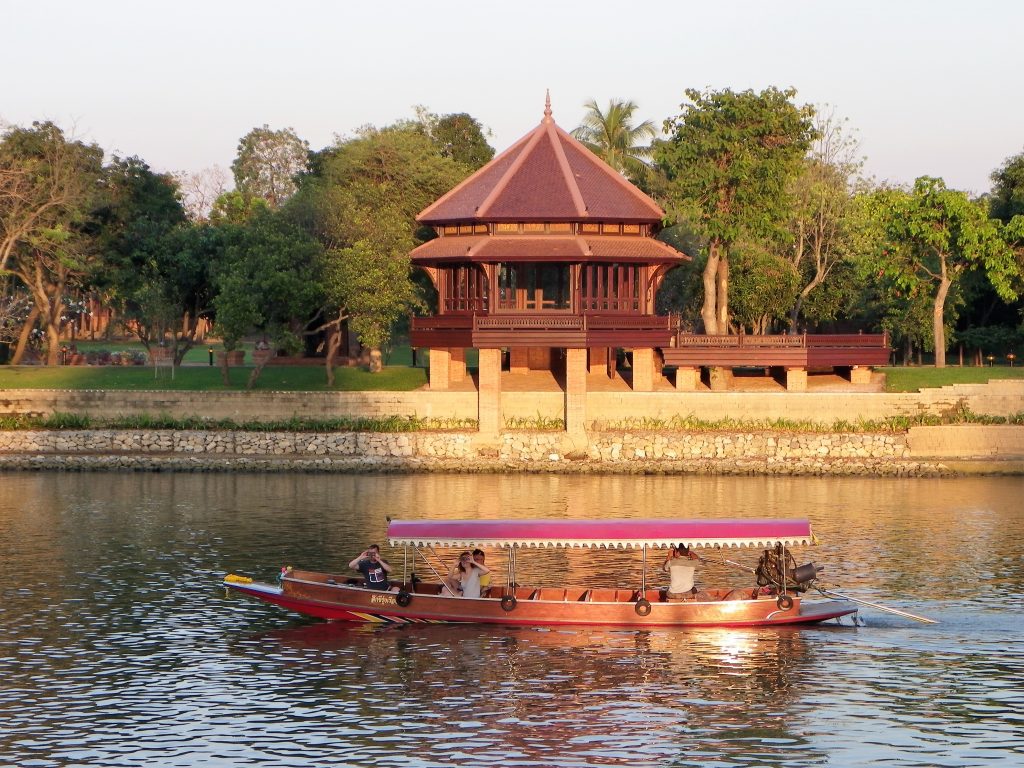 Small Boat on a river in front of a temple