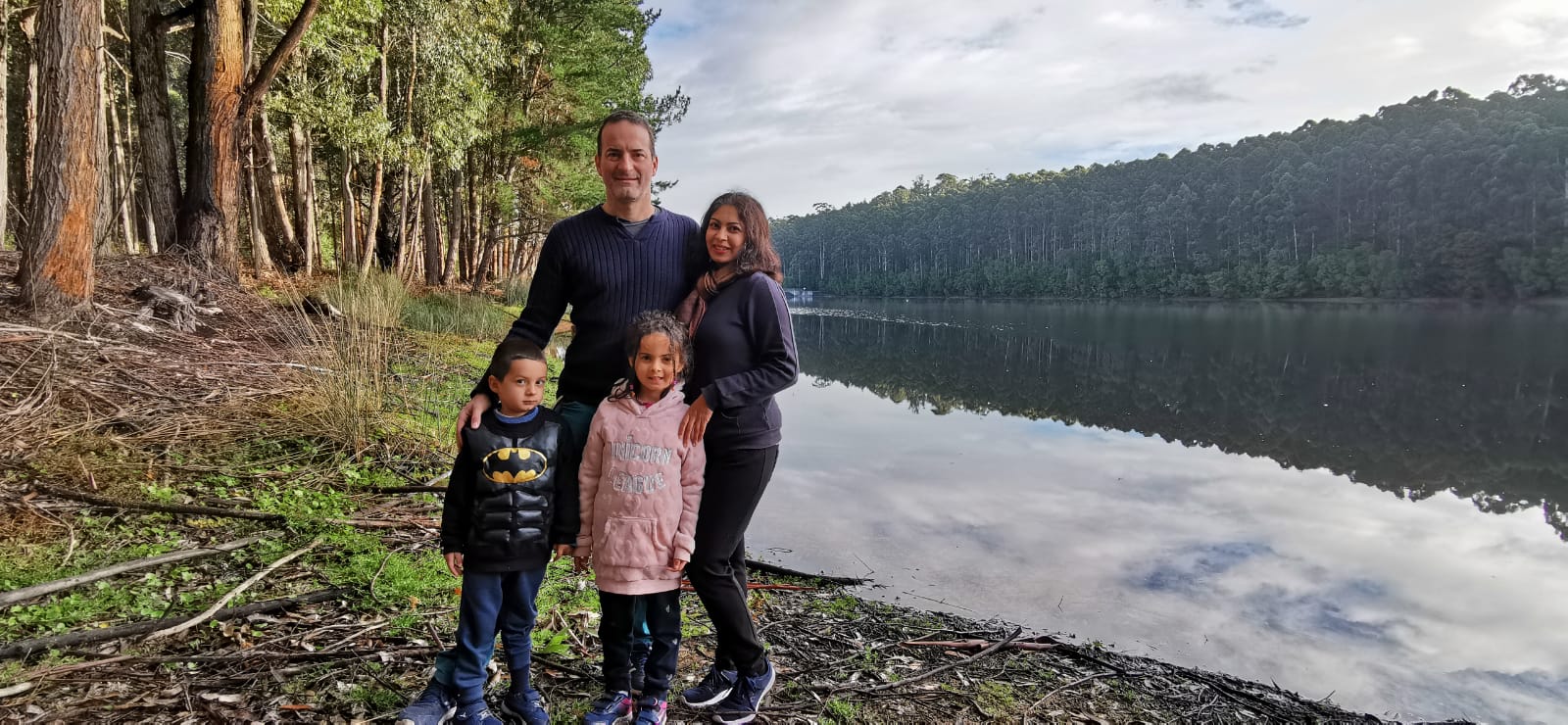 Family by the lake and a forest