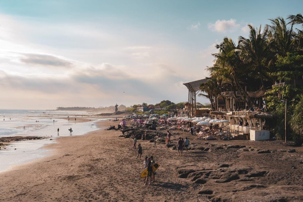 Late afternoon sandy beach with people