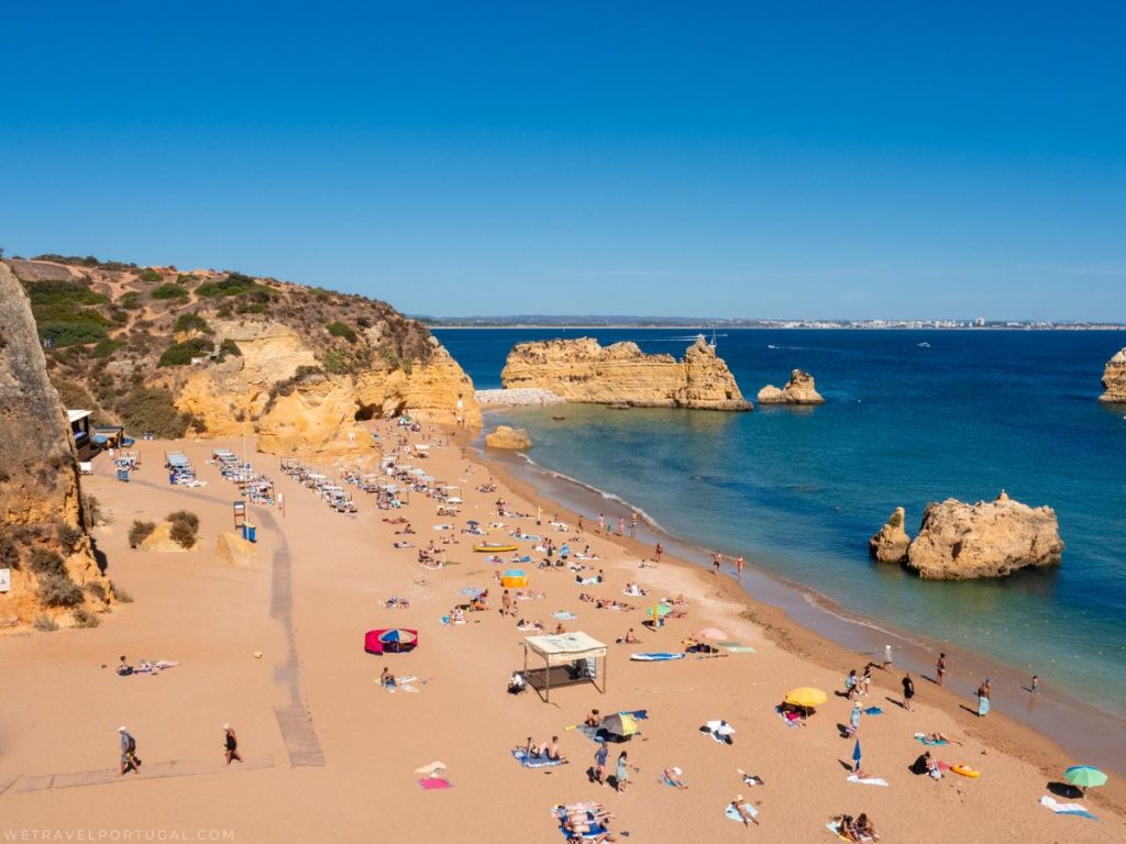 golden hour sand beach with blue sky and blue water