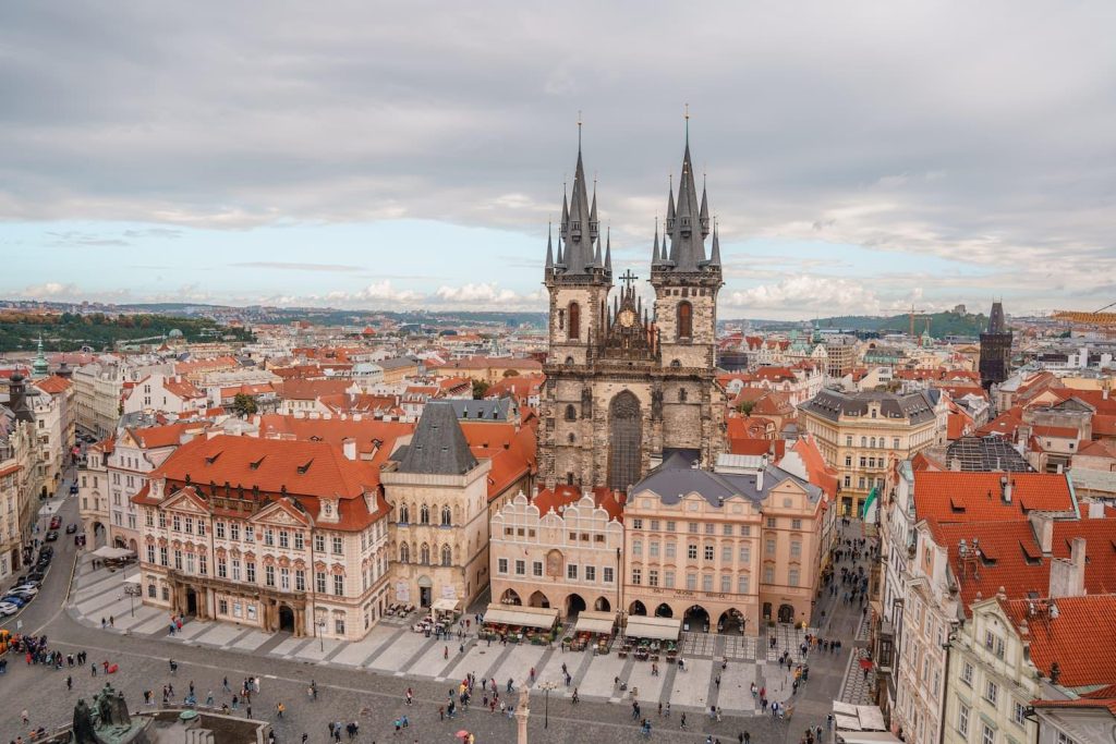 Beautiful gothic church over red roofs and a square