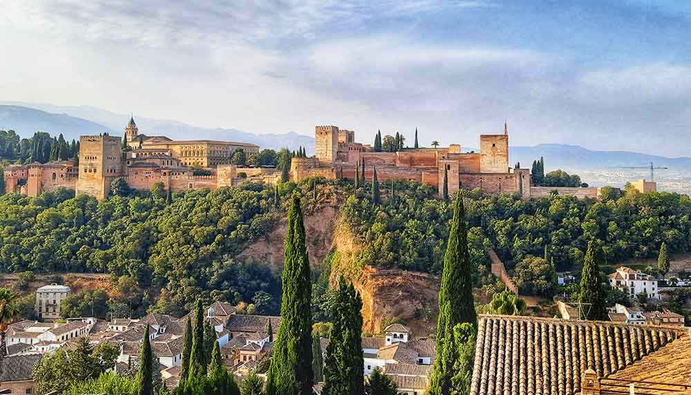 Dramatic Alhambra, trees and roofs