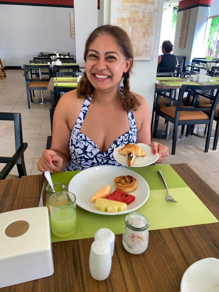 Woman having a breakfast in an hotel