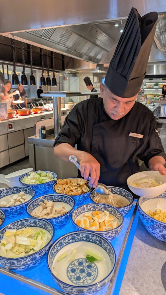 Chef serving food in a bowl